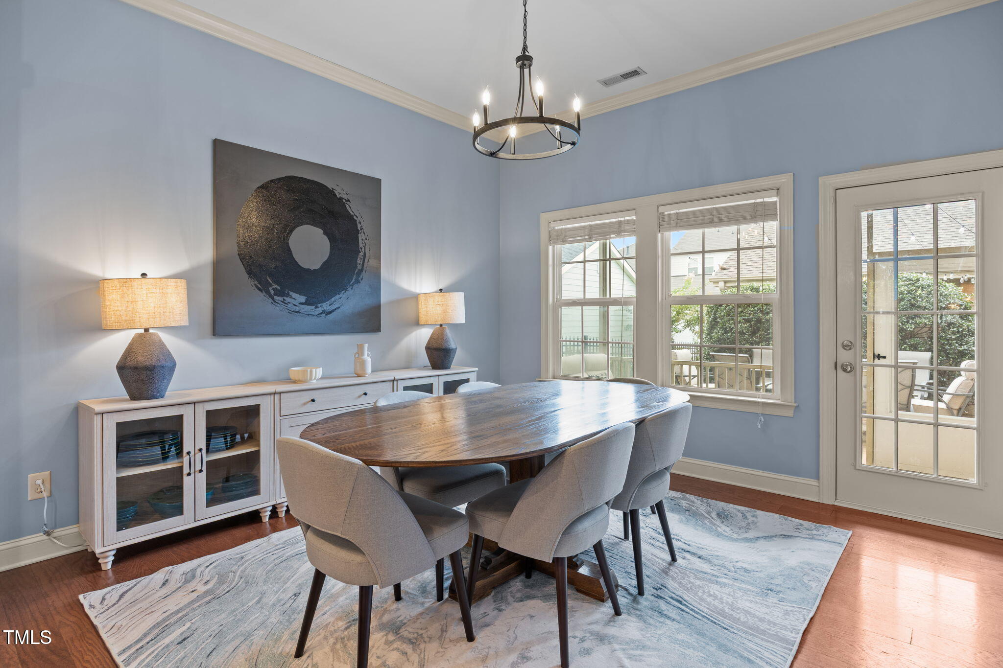 831 Historian Street Raleigh, NC 27603 - Photo 26 of 52 a view of a dining room with furniture window and wooden floor