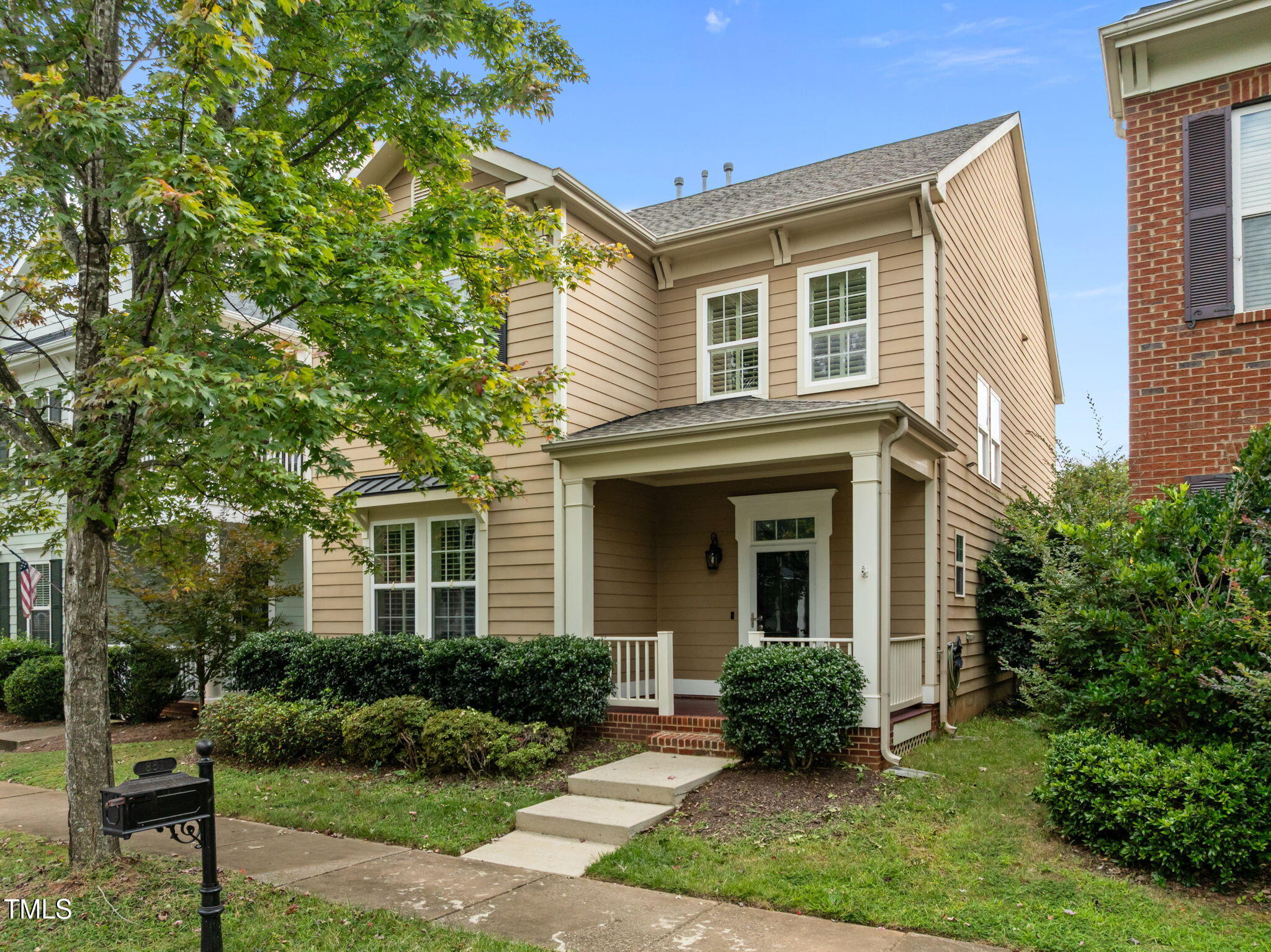 831 Historian Street Raleigh, NC 27603 - Photo 3 of 52 a front view of a house with a yard