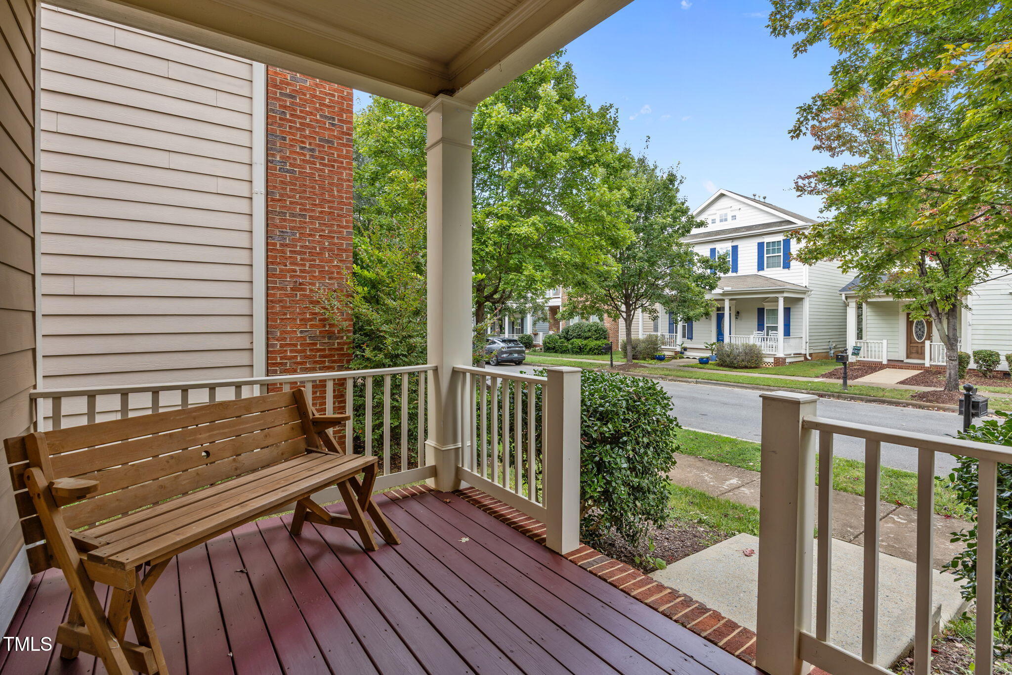 831 Historian Street Raleigh, NC 27603 - Photo 8 of 52 a view of a deck with a table and chairs next to a yard