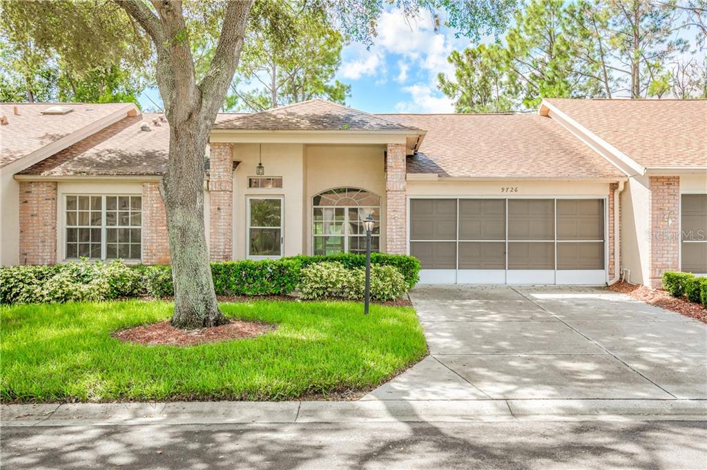 9726 Sweeping View Drive New Port Richey, FL 34655 - Photo 1 of 1 front view of a house with a yard