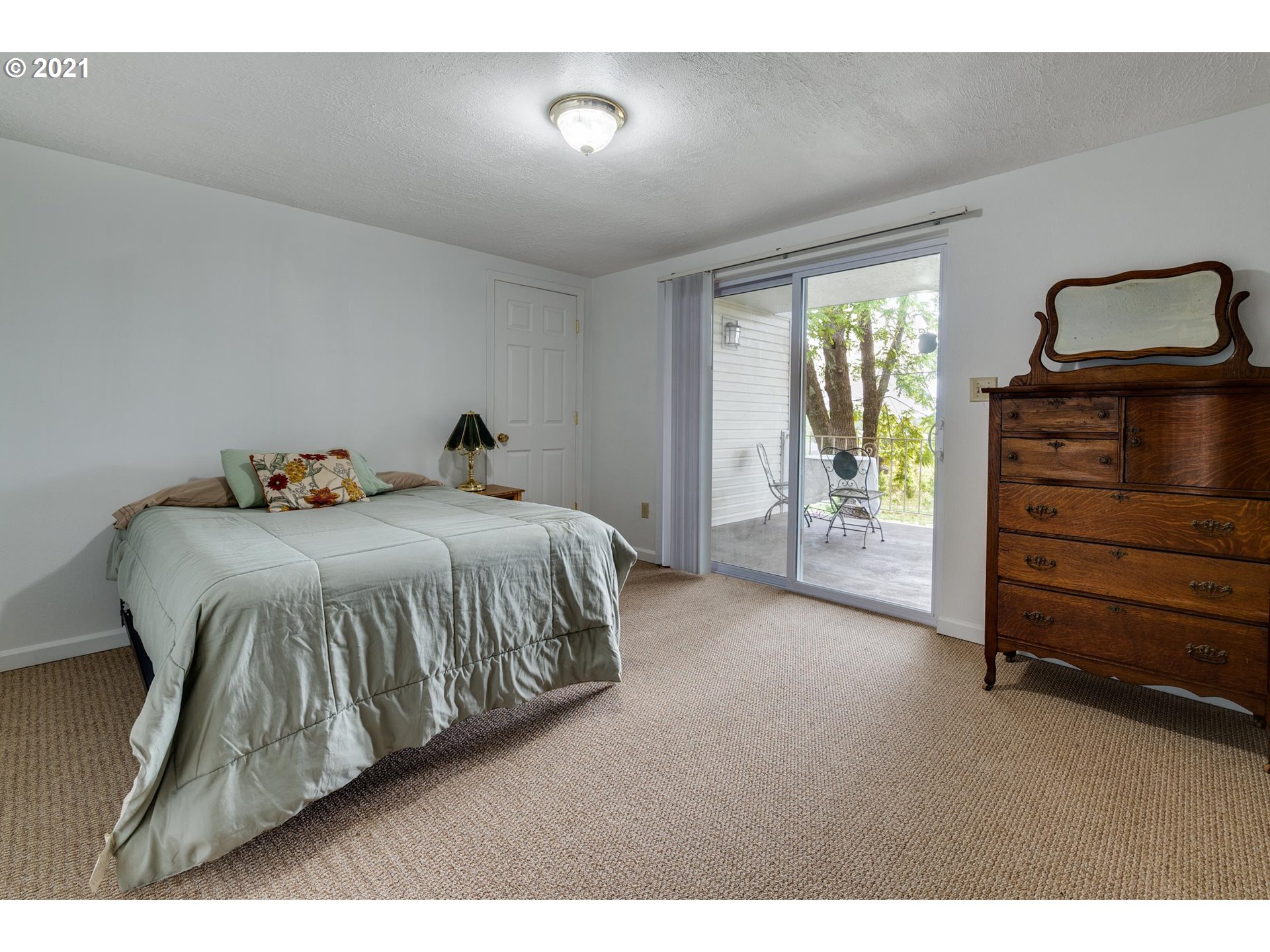 2559 Southwest Dilley Road Forest Grove, OR 97116 - Photo 22 of 32 a bedroom with a bed and a closet