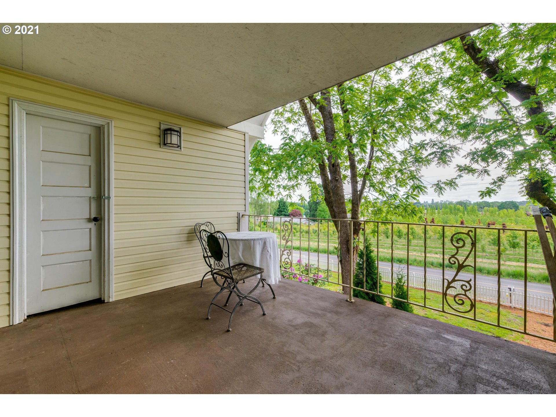 2559 Southwest Dilley Road Forest Grove, OR 97116 - Photo 23 of 32 a backyard of a house with table and chairs