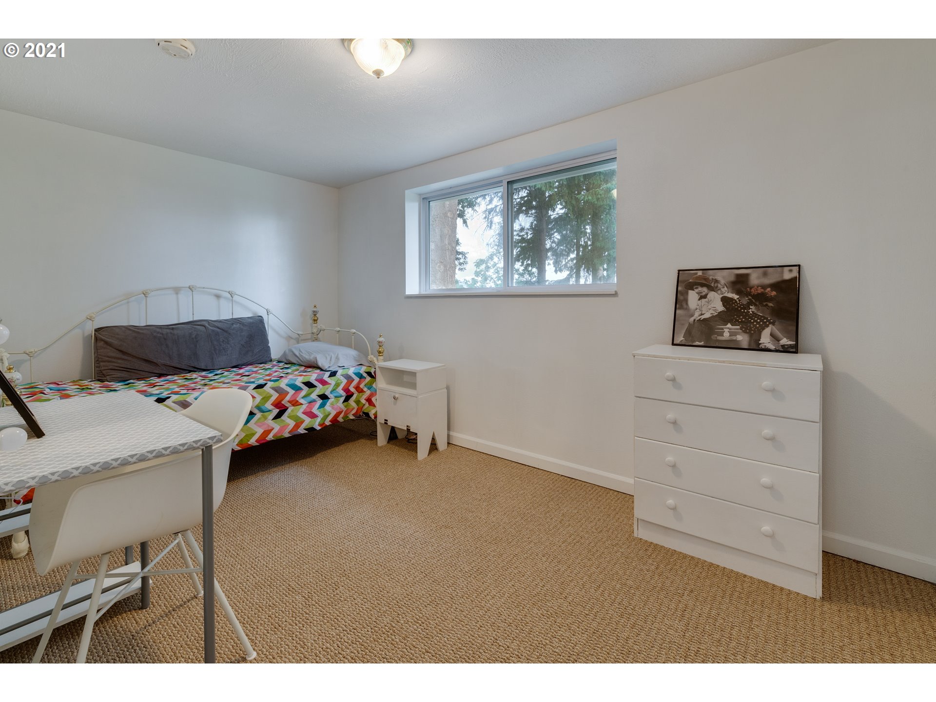 2559 Southwest Dilley Road Forest Grove, OR 97116 - Photo 27 of 32 a bedroom with a bed and furniture