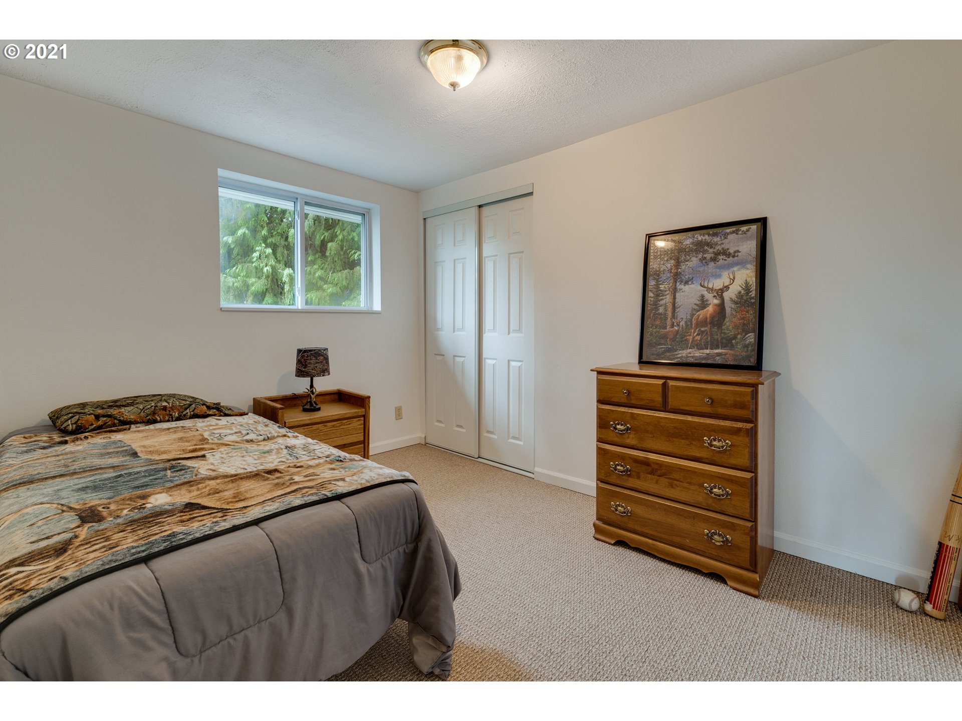 2559 Southwest Dilley Road Forest Grove, OR 97116 - Photo 28 of 32 a bedroom with a bed and a desk