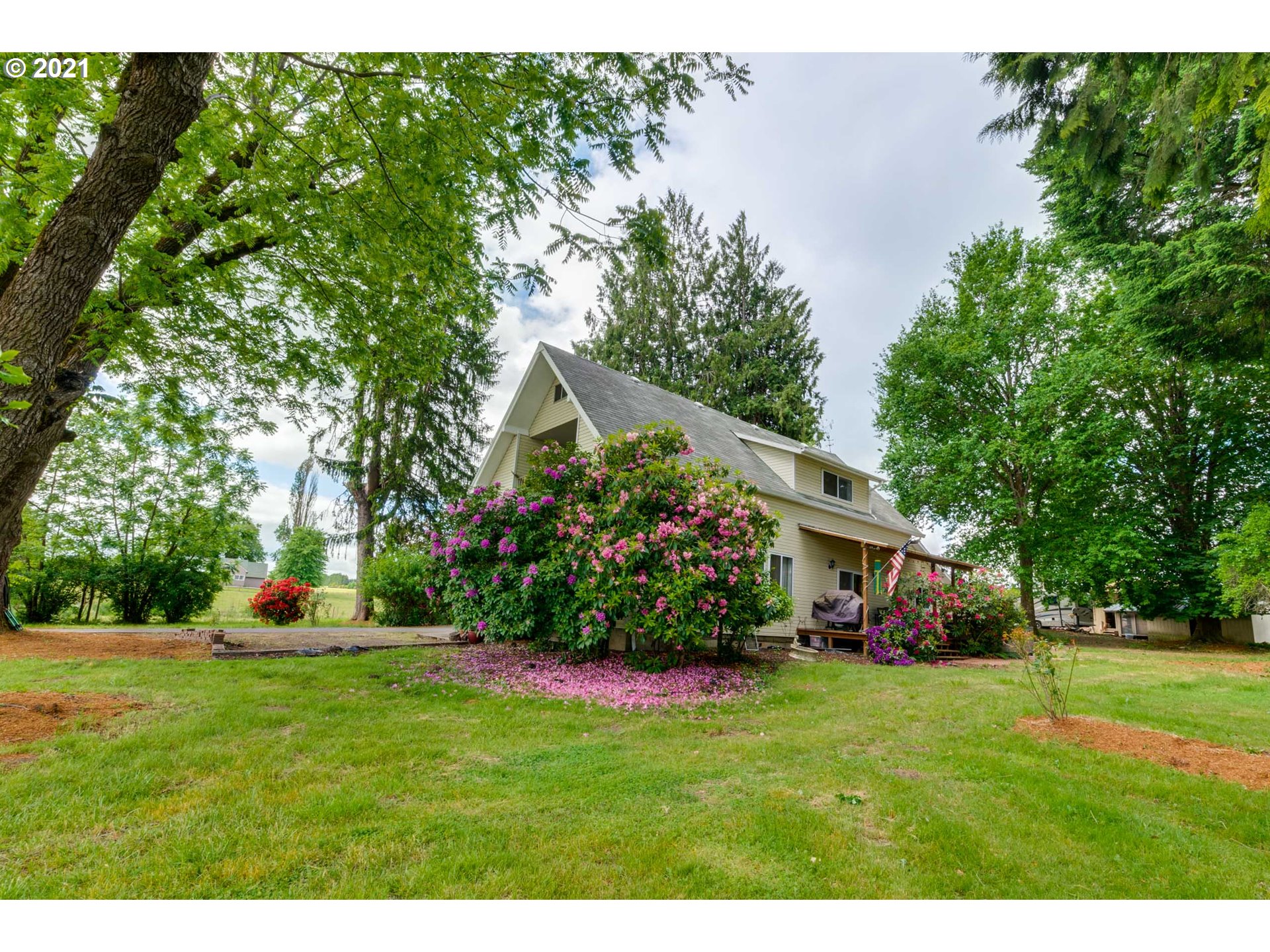 2559 Southwest Dilley Road Forest Grove, OR 97116 - Photo 5 of 32 a view of an house with backyard space and garden