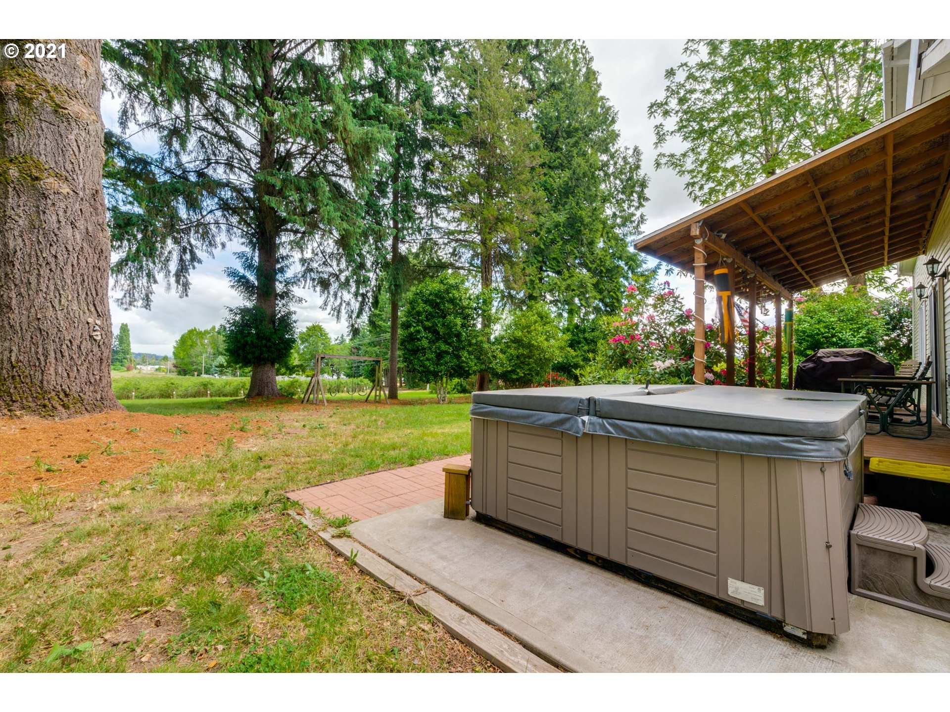 2559 Southwest Dilley Road Forest Grove, OR 97116 - Photo 7 of 32 a view of backyard with swimming pool and outdoor seating