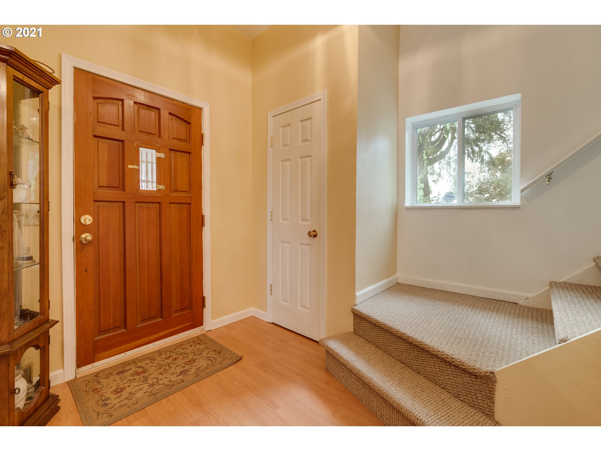 2559 Southwest Dilley Road Forest Grove, OR 97116 - Photo 9 of 32 a view of an empty room with wooden floor and a window