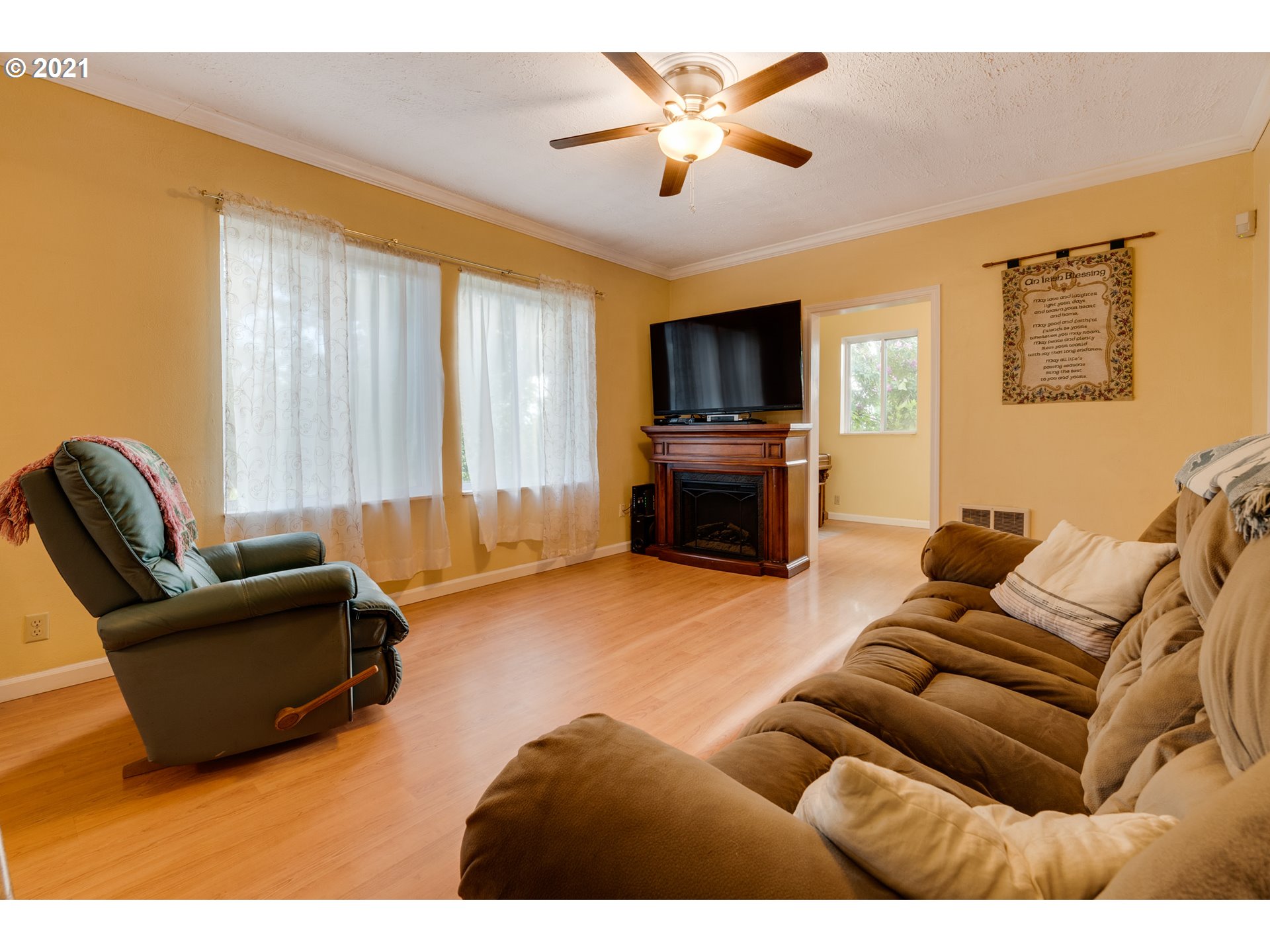 2559 Southwest Dilley Road Forest Grove, OR 97116 - Photo 10 of 32 a living room with furniture a large window and a flat screen tv