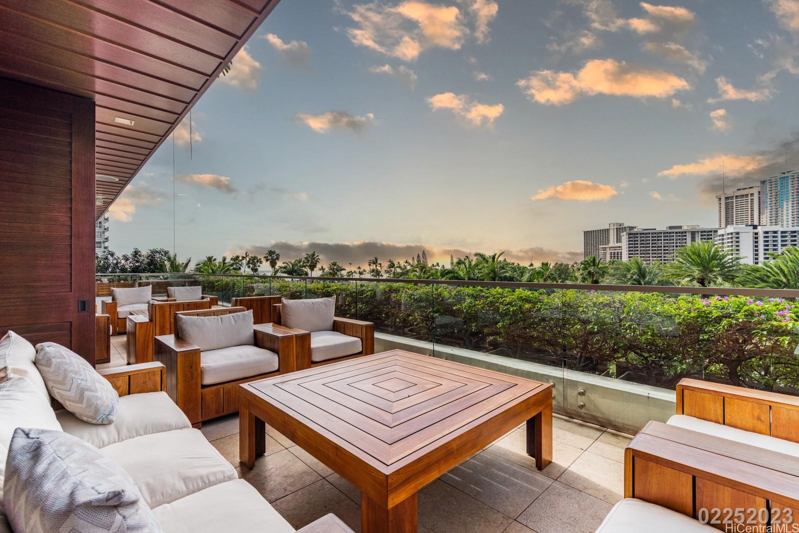 223 Saratoga Road, Unit 918 Honolulu, HI 96815 - Photo 20 of 25 a view of a terrace with couches and pool