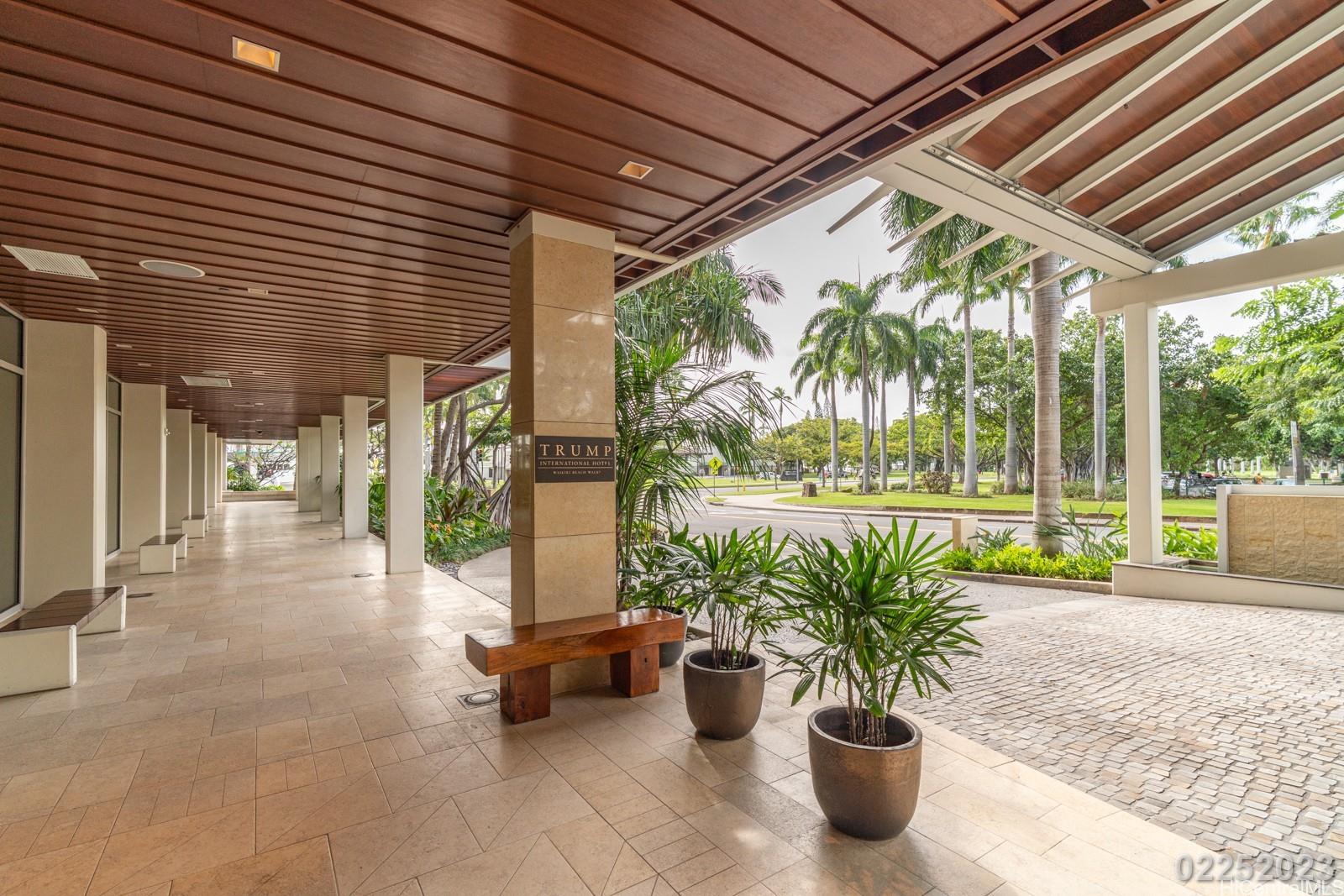 223 Saratoga Road, Unit 918 Honolulu, HI 96815 - Photo 3 of 25 a lobby with furniture and potted plants