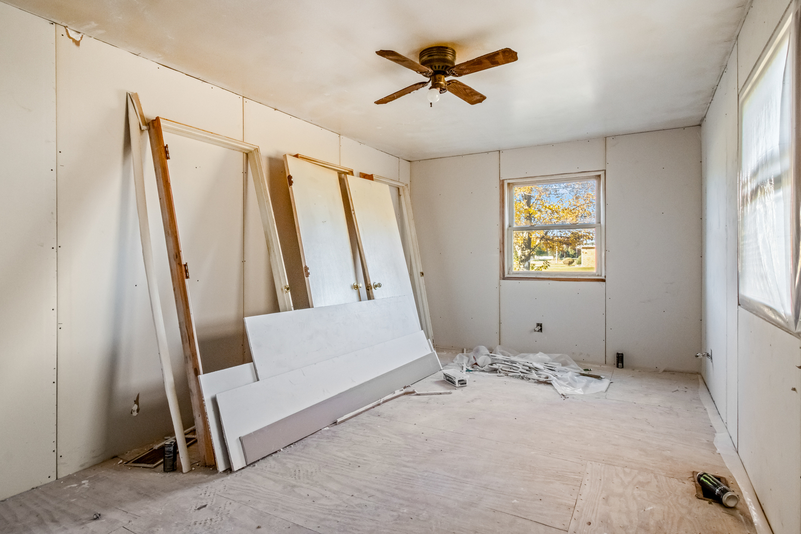 5827 East 3500S Road St. Anne, IL 60964 - Photo 11 of 16 a living room with a bed furniture and a window