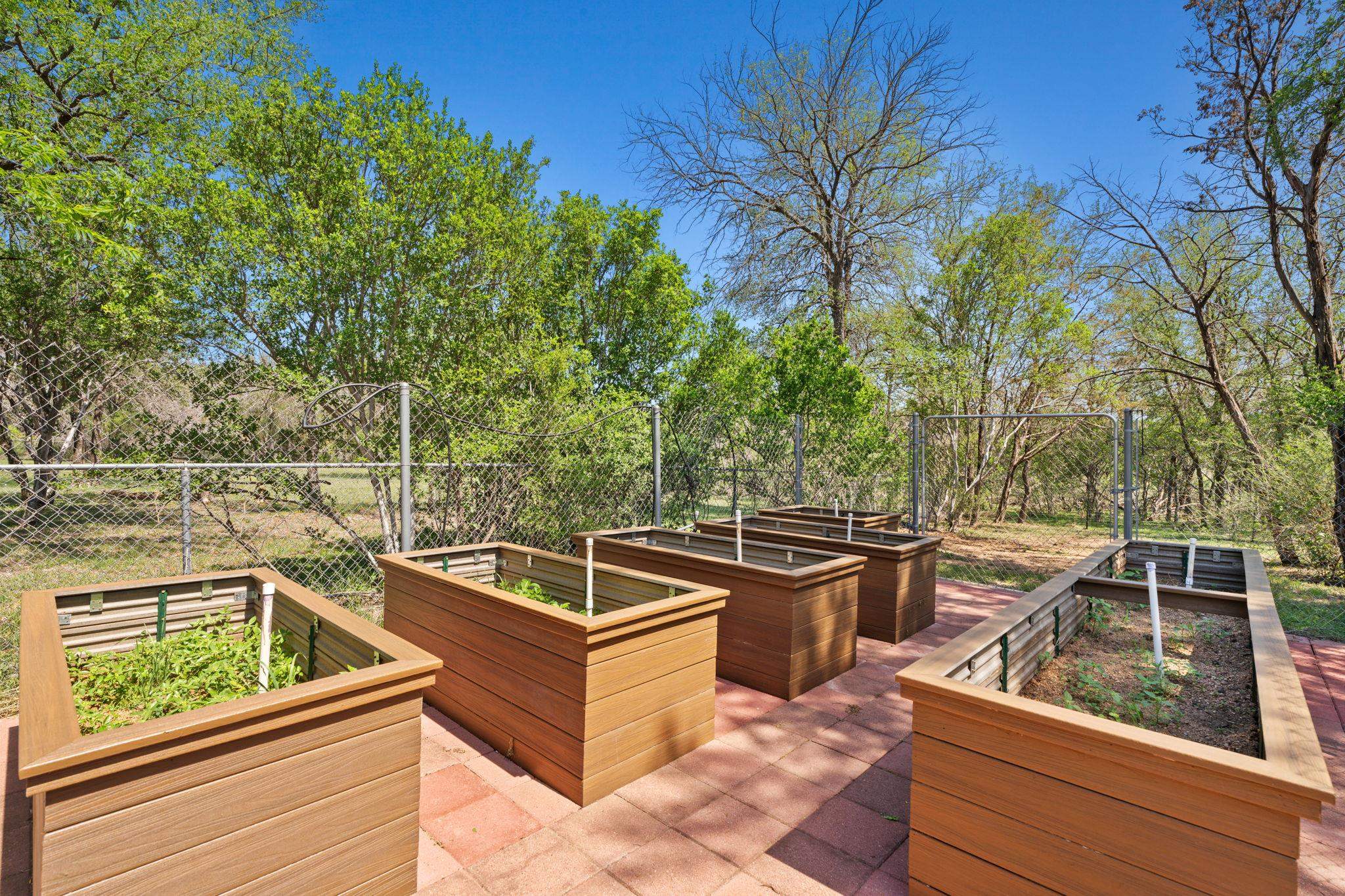 2409 Mormon Mill Road Marble Falls, TX 78654 - Photo 23 of 30 a view of a roof deck with couches and wooden fence