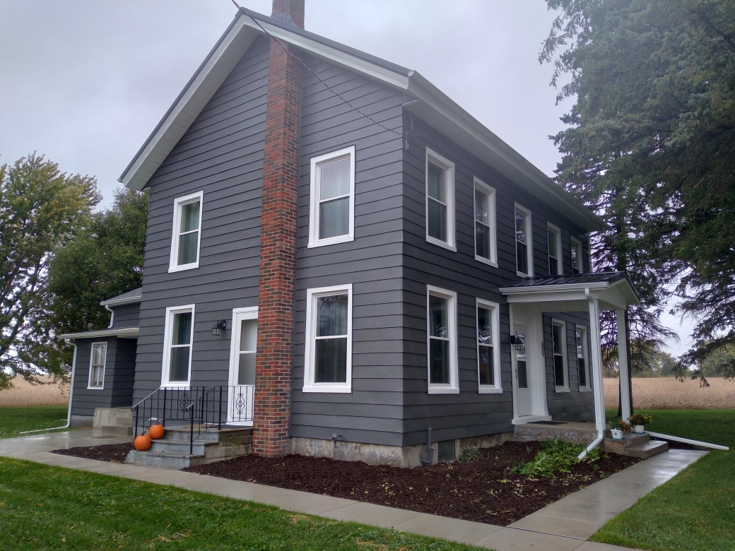 5122 North Bennett Road Monroe Center, IL 61052 - Photo 1 of 29 a front view of a house with a yard and tree