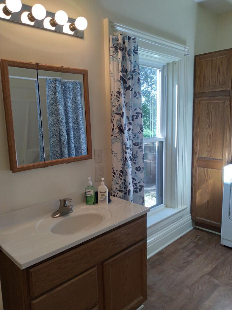 5122 North Bennett Road Monroe Center, IL 61052 - Photo 15 of 29 a bathroom with a sink and a mirror