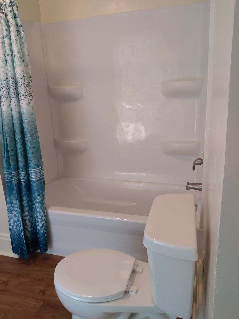 5122 North Bennett Road Monroe Center, IL 61052 - Photo 16 of 29 a bathroom with a toilet and bathtub
