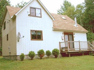 388 High Pine Meadows Road Middleburgh, NY 12122 - Photo 1 of 1 a front view of a house with garden
