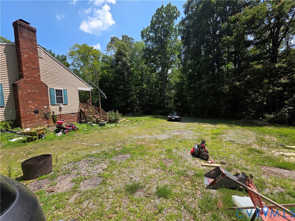 3161 Dorrell Road Aylett, VA 23009 - Photo 33 of 41 a view of backyard with garden and entertaining space
