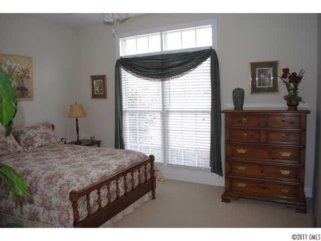 116 Generals Way, Unit 5 Clover, SC 29710 - Photo 11 of 16 a bedroom with a bed and a dresser