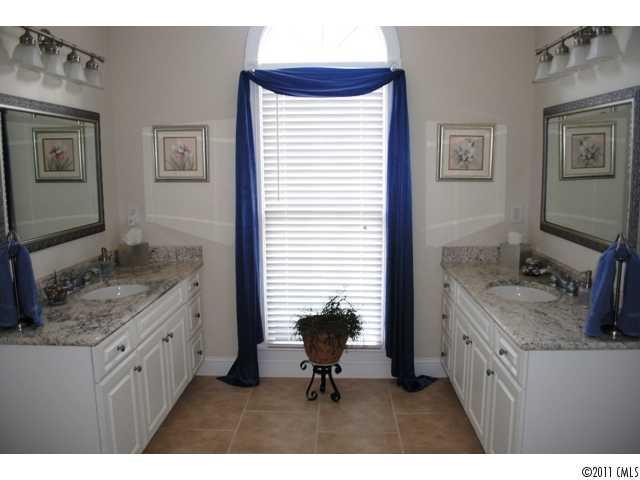116 Generals Way, Unit 5 Clover, SC 29710 - Photo 12 of 16 a bathroom with a granite countertop sink a toilet and mirror