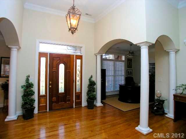 116 Generals Way, Unit 5 Clover, SC 29710 - Photo 4 of 16 a view of a livingroom with entryway wooden floor and furniture
