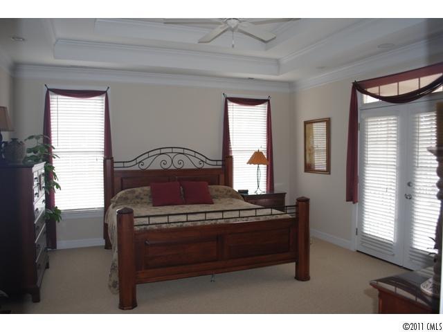 116 Generals Way, Unit 5 Clover, SC 29710 - Photo 8 of 16 a bed sitting in a bedroom next to a window