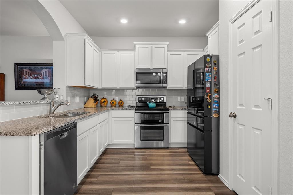 2912 Brosnan Road Lorena, TX 76655 - Photo 10 of 25 a kitchen with stainless steel appliances granite countertop a refrigerator and a sink