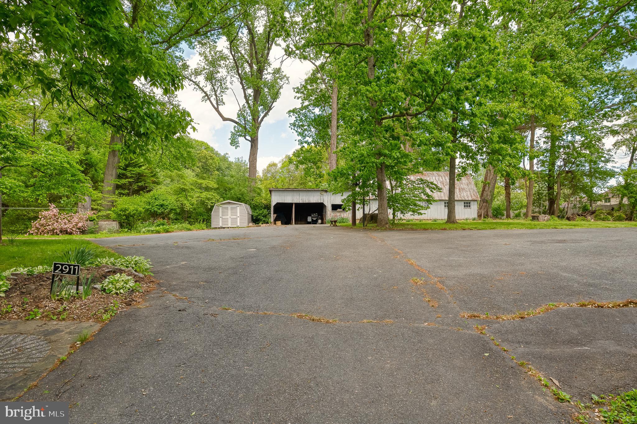 2911 Nelson Lane Fallston, MD 21047 - Photo 62 of 85 a front view of a house with garden and trees