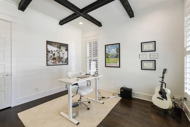 a work room with furniture and wooden floor