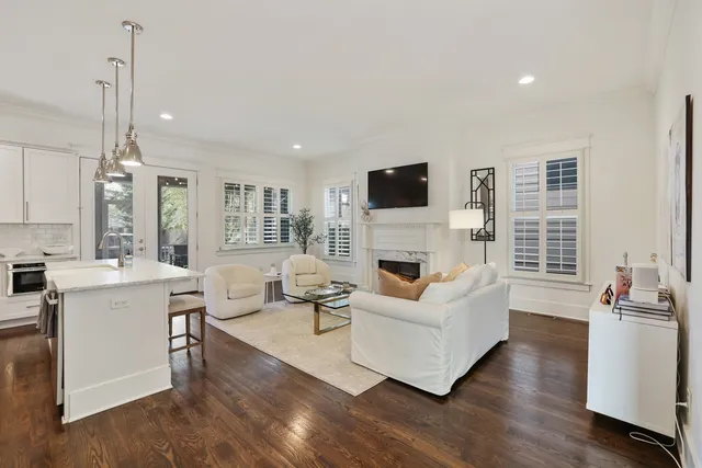 a living room with furniture fireplace and flat screen tv