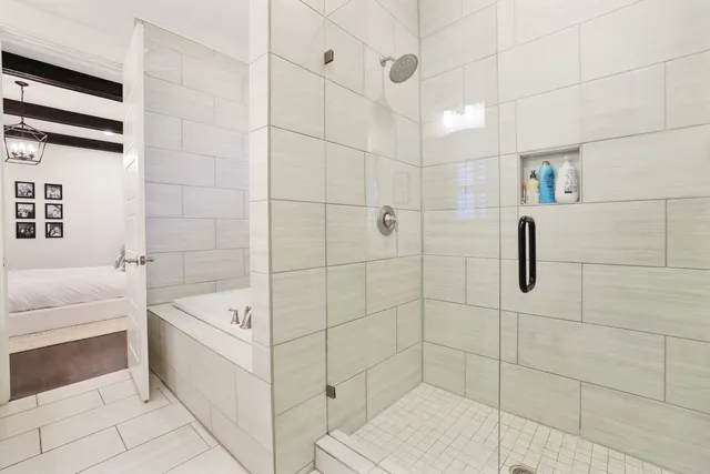 a bathroom with a bathtub and a shower