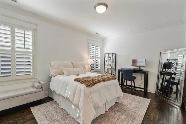 a bed room with a bed and a table