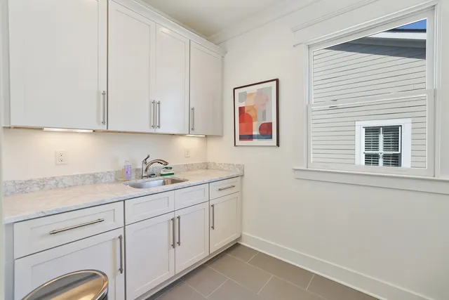 a kitchen with a sink and cabinets