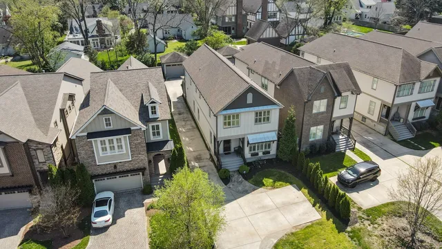 an aerial view of a residential apartment building with a yard