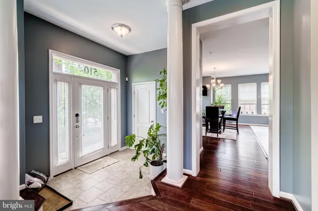 a living room with fireplace furniture and a wooden floor