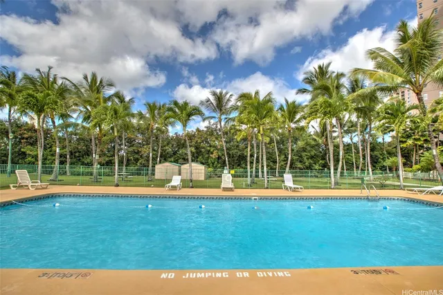 a view of a house with backyard porch and sitting area