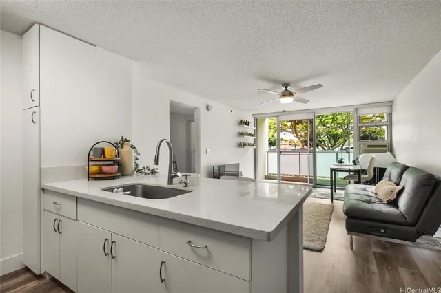 a kitchen with a sink and a large window