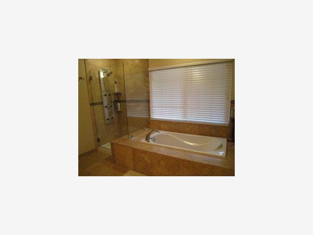 1452 Brookmill Road Los Altos, CA 94024 - Photo 8 of 9 a bathroom with a tub shower and sink