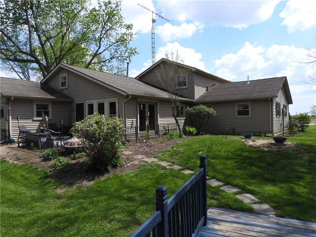 2185 East Loy Road Piqua, OH 45356 - Photo 18 of 19 The home features an expansive yard, perfect for outdoor activities and serene relaxation.