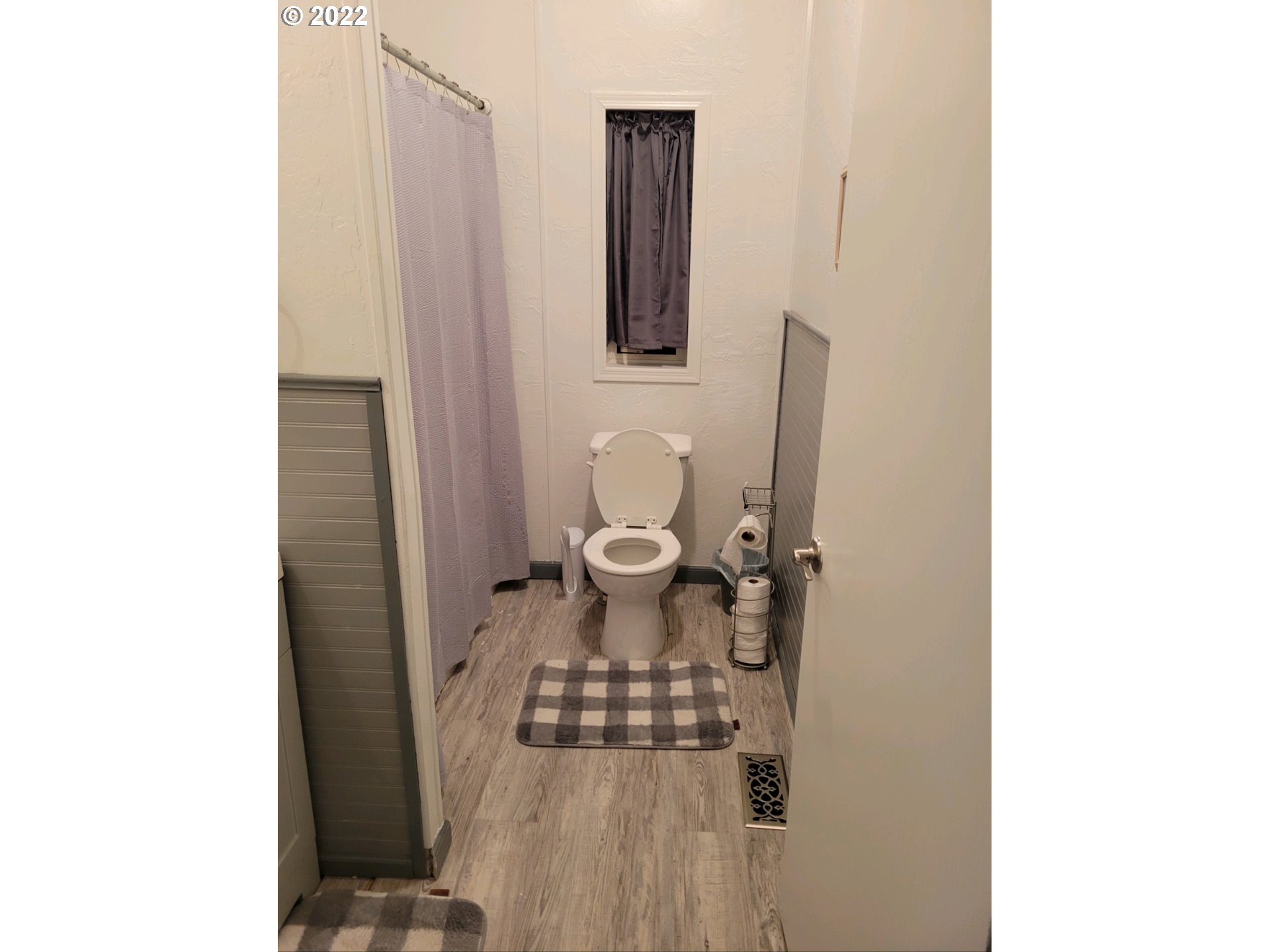 2600 Southwest Goodwin Avenue, Unit 5 Pendleton, OR 97801 - Photo 15 of 31 a bathroom with a toilet and a mirror