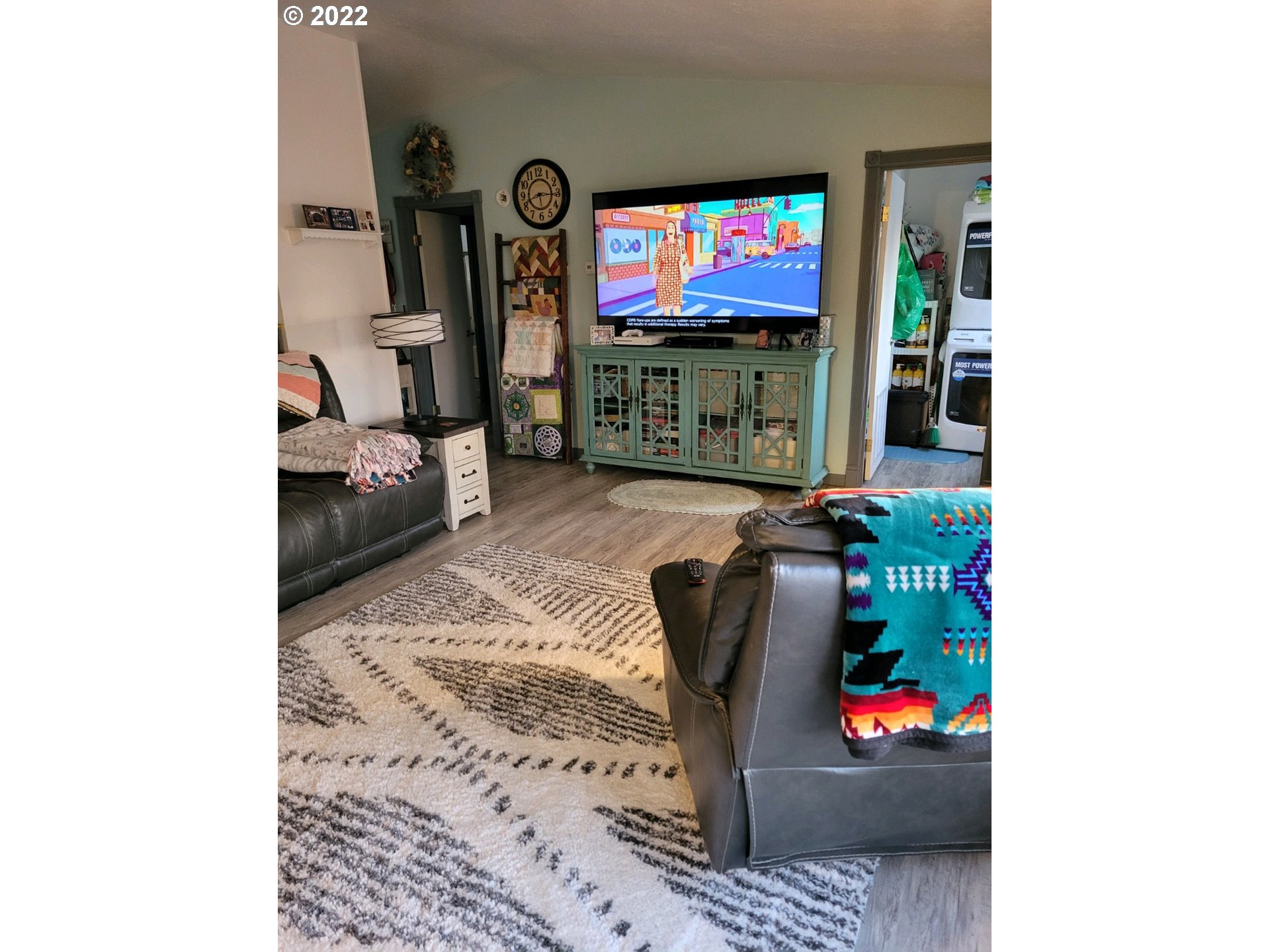 2600 Southwest Goodwin Avenue, Unit 5 Pendleton, OR 97801 - Photo 22 of 31 a living room with furniture and a flat screen tv