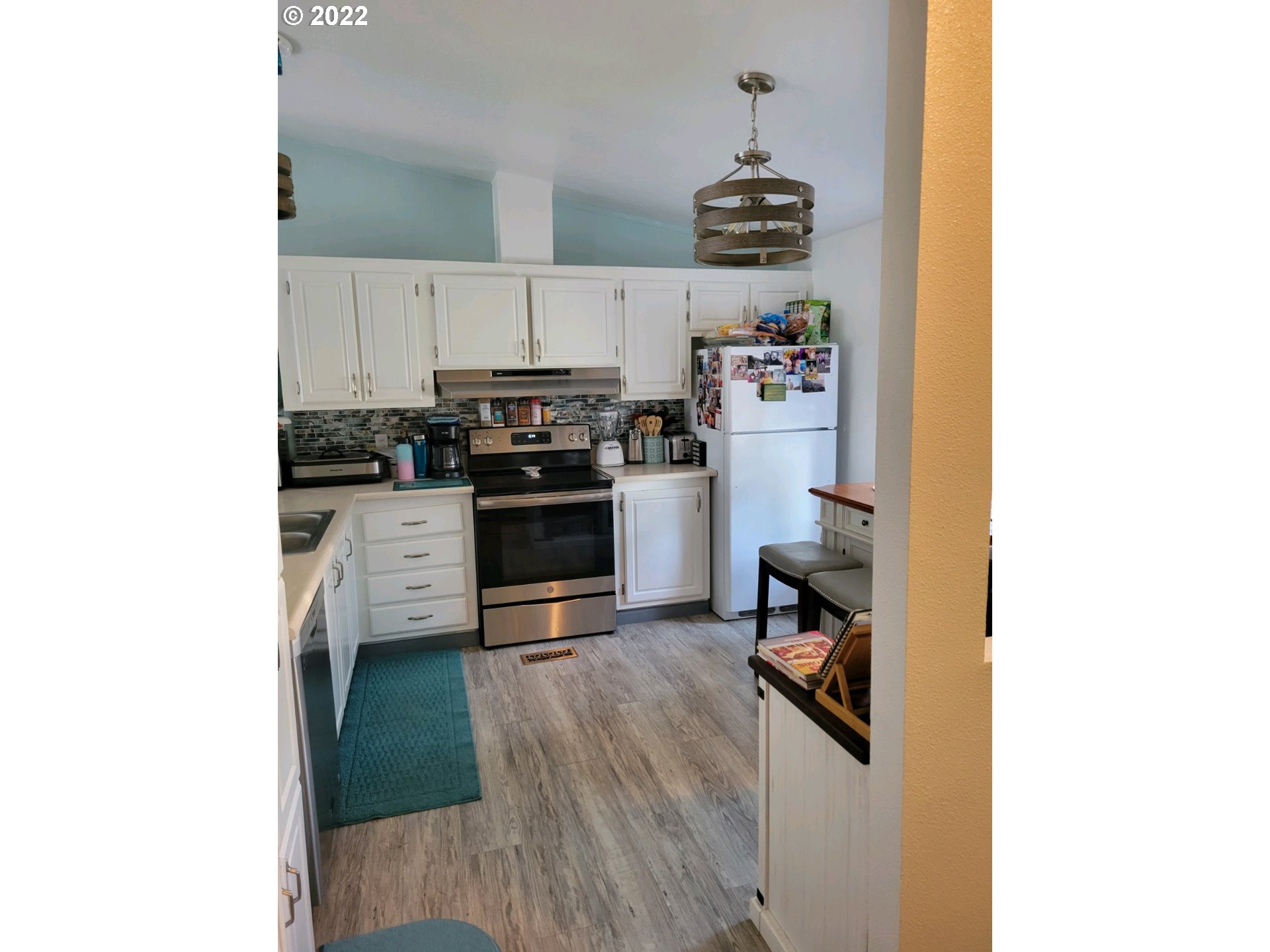 2600 Southwest Goodwin Avenue, Unit 5 Pendleton, OR 97801 - Photo 29 of 31 a kitchen with stainless steel appliances granite countertop a stove and a refrigerator