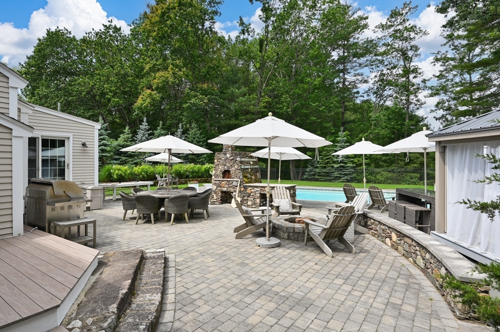 46 Baldpate Road Boxford, MA 01921 - Photo 31 of 42 a view of backyard with outdoor seating and trees