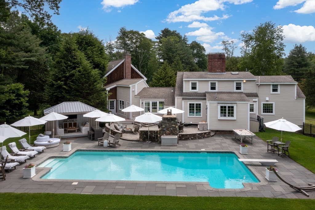 46 Baldpate Road Boxford, MA 01921 - Photo 34 of 42 a front view of a house with furniture and a yard