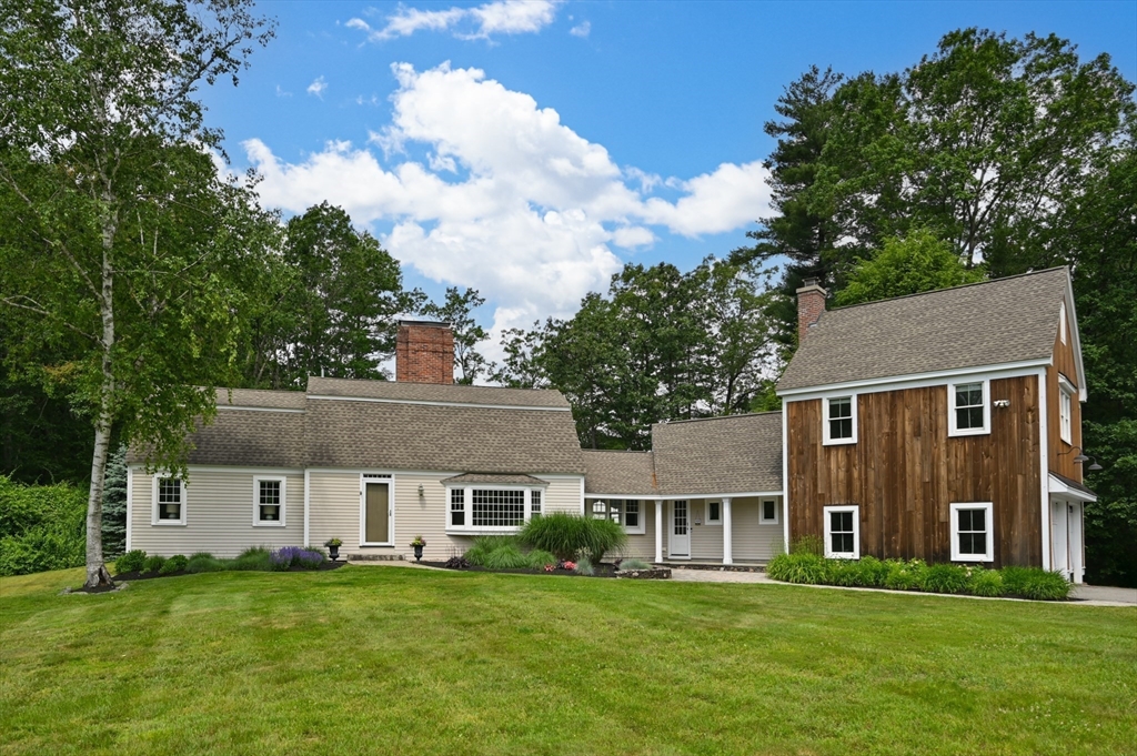 46 Baldpate Road Boxford, MA 01921 - Photo 5 of 42 a front view of a house with a garden