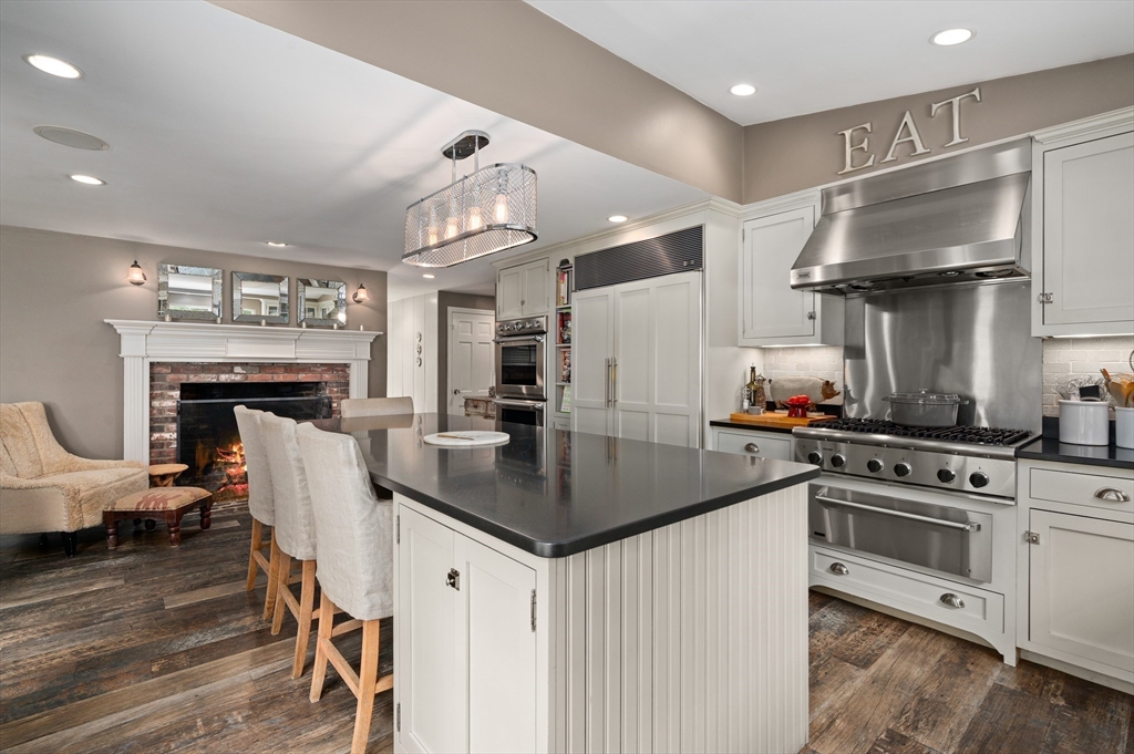 46 Baldpate Road Boxford, MA 01921 - Photo 6 of 42 a kitchen with granite countertop a stove and white cabinets