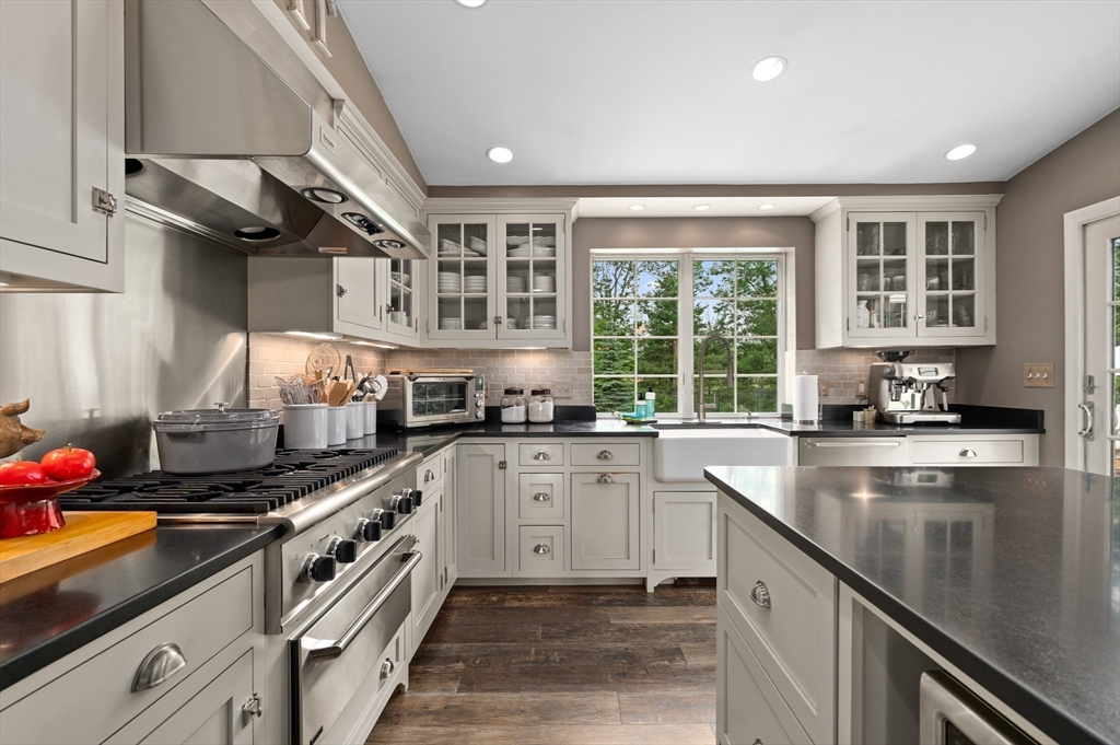 46 Baldpate Road Boxford, MA 01921 - Photo 8 of 42 a kitchen with stainless steel appliances a sink stove and cabinets