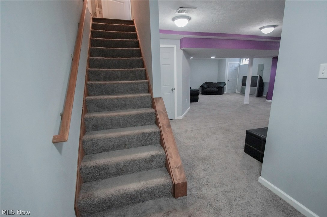 38757 Adkins Road Willoughby, OH 44094 - Photo 18 of 22 Steps to Finished Basement looking into Family Room