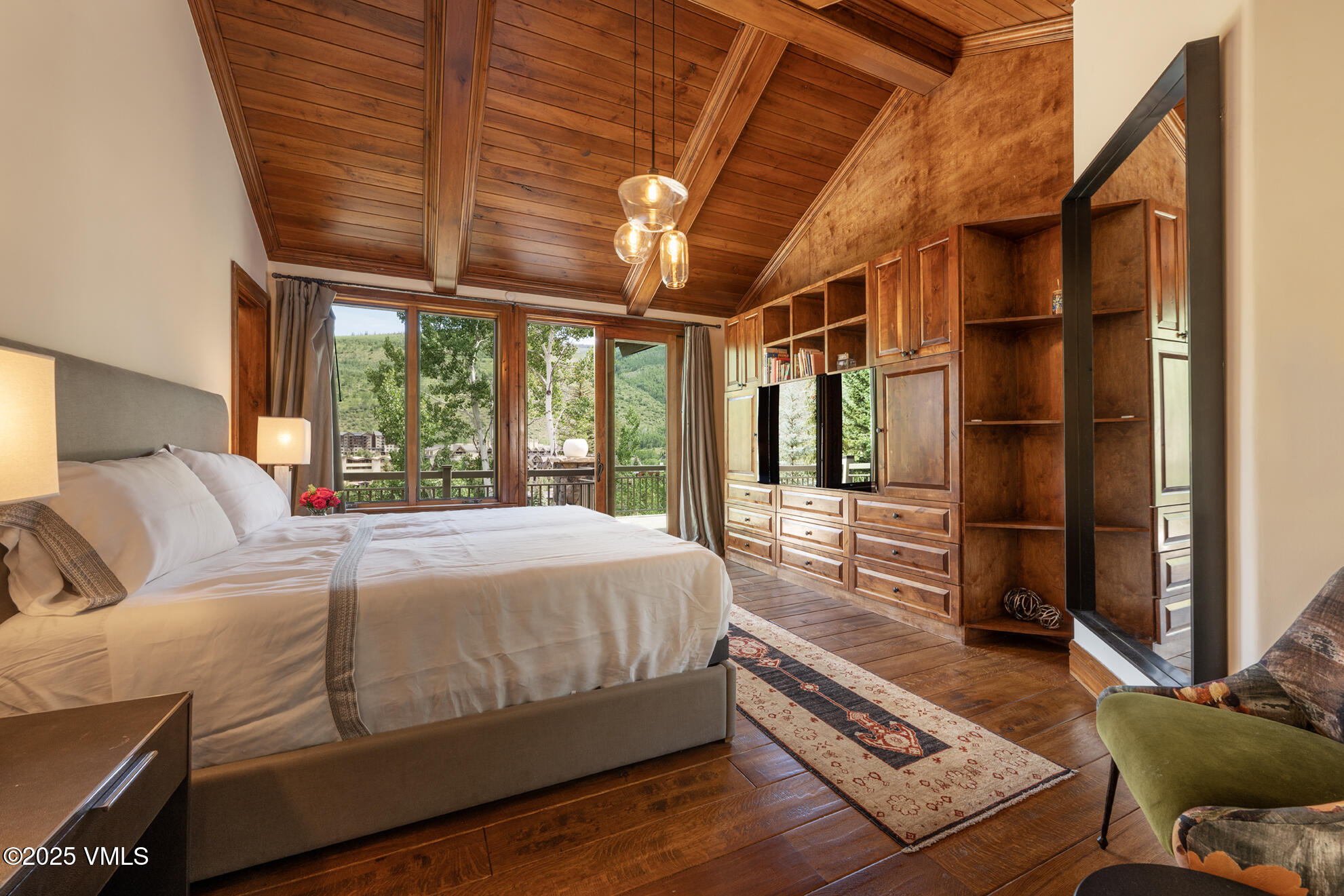 185 Forest Road Vail, CO 81657 - Photo 3 of 13 a bedroom with a large bed and a large window