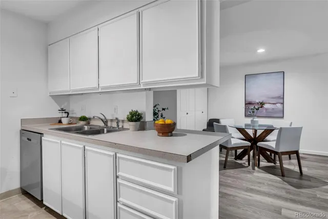 a kitchen with stainless steel appliances granite countertop a sink and cabinets