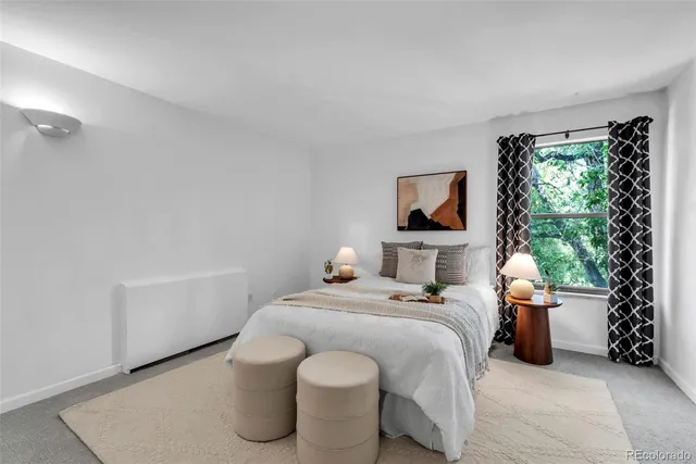 a bedroom with a bed and window